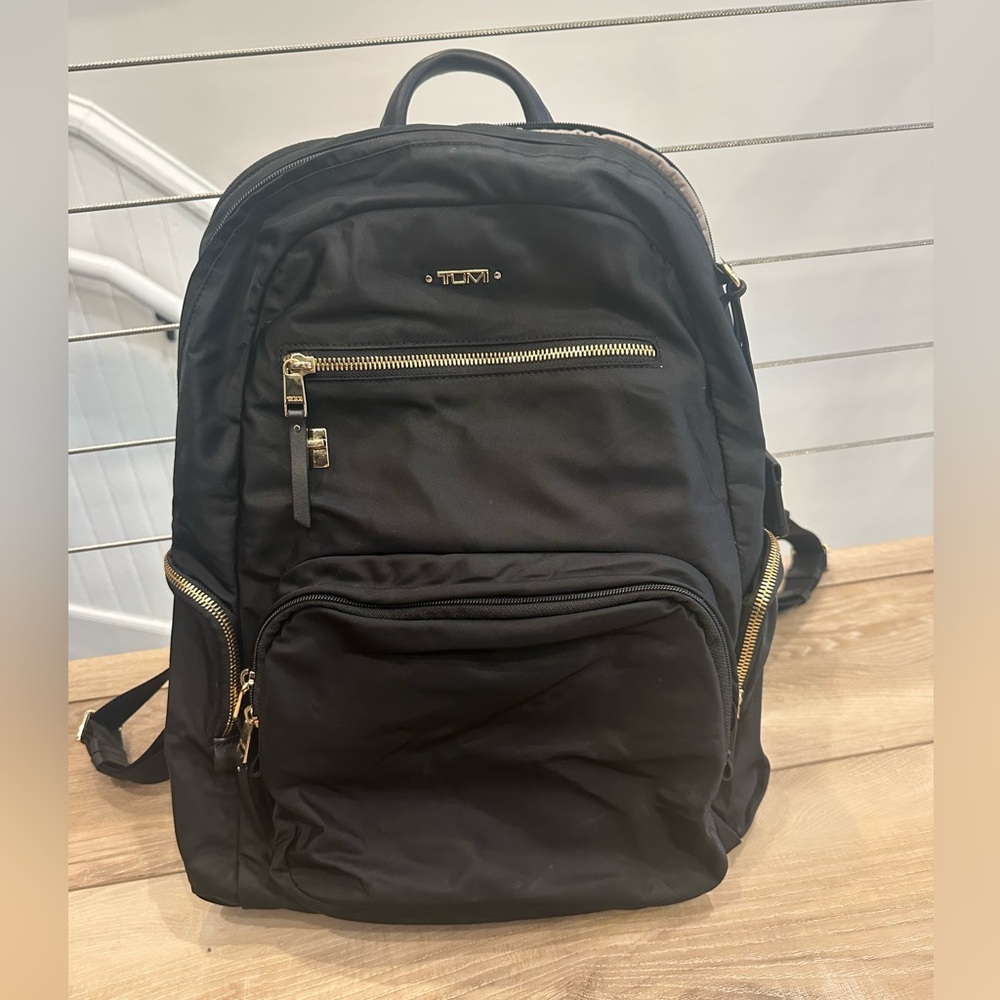 Tumi Black Backpack with Gold Accents